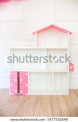 Doll houses in the children's room, furniture for children in the interior of the children's room
