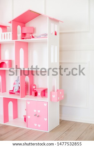 Doll houses in the children's room, furniture for children in the interior of the children's room
