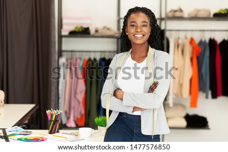 Successful Fashion Business. Smiling Black Designer Posing In Own Dressmaking Studio Or Boutique. Free Space Royalty-Free Stock Photo #1477576850
