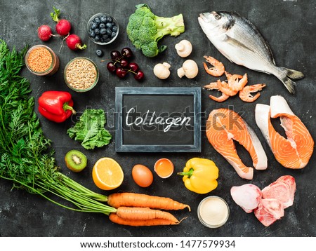 Food rich in collagen. Various food ingredients and chalkboard with Collagen letters over dark background. Top view or flat lay Royalty-Free Stock Photo #1477579934