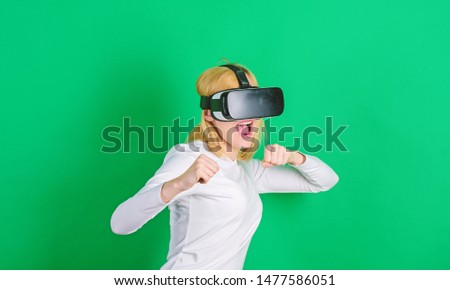 Woman excited using 3d goggles. Excited smiling businesswoman wearing virtual reality glasses. 3d technology, virtual reality, entertainment, cyberspace and people concept. Interfaces
