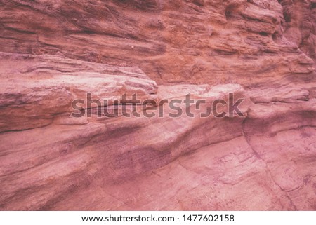 Stone texture. Red canyon in desert. Dry riverbed, wilderness. Abstract stone nature background