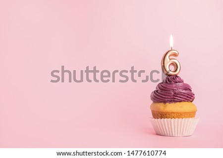 Birthday cupcake with number six candle on pink background, space for text Royalty-Free Stock Photo #1477610774