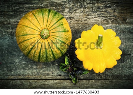 Pumpkin and pattypan, gardening vegetable on old wooden board