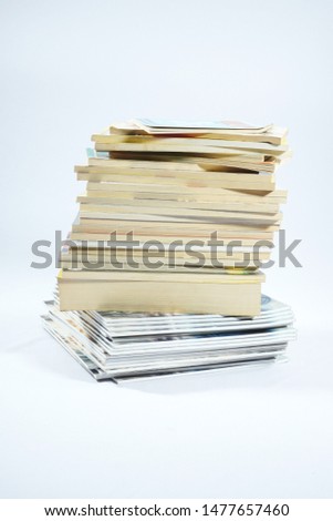 Stack of coomic books with white background