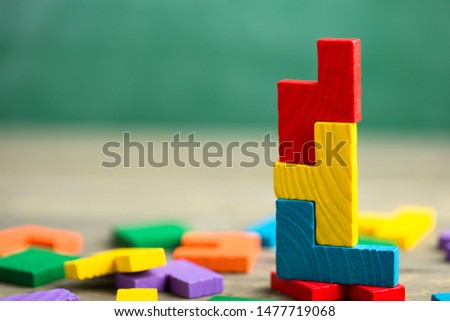 Creative solution for idea - business concept, jigsaw puzzle on the green blackboard background Royalty-Free Stock Photo #1477719068