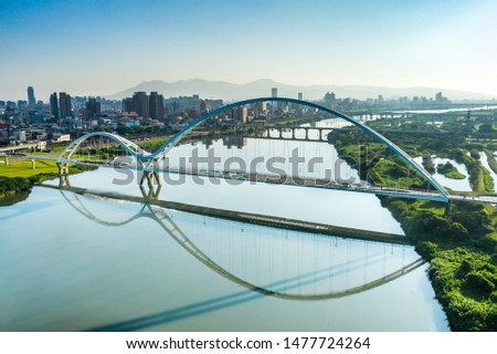 Crescent Bridge - landmark of New Taipei, Taiwan with beautiful illumination at day, aerial photography in New Taipei, Taiwan.