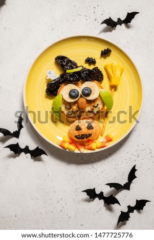 Owl pancake with fruits for kids breakfast on Halloween
