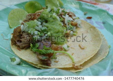 Authentic taco filled with pork salsa from a taco stand in Mexico
