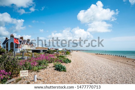Pevensey Bay, East Sussex, England. Typical beach front houses along the coastline of a pebble beach on the south coast of England.