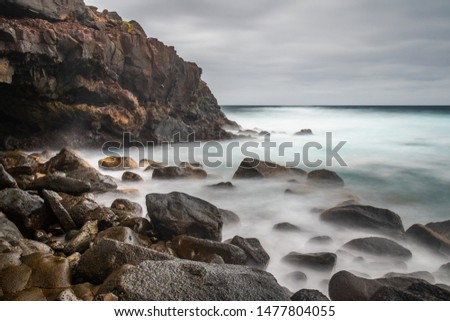 Long exposure photography on rocky beach