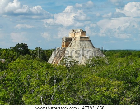 Pyramid of the Magician. -Mayan ruins of Uxmal, Yucatan, Mexico, side view - Archeological site, tourist destination, The pyramid is the biggest in the ruins of the ancient Mayan city Uxmal.
