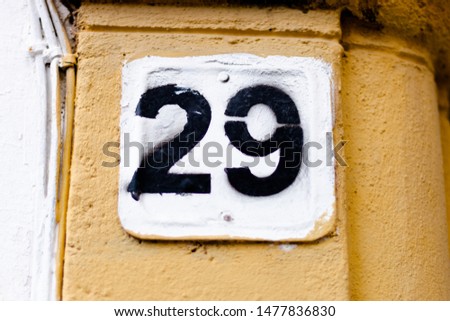 A house number 29 (twenty nine) sign close up
