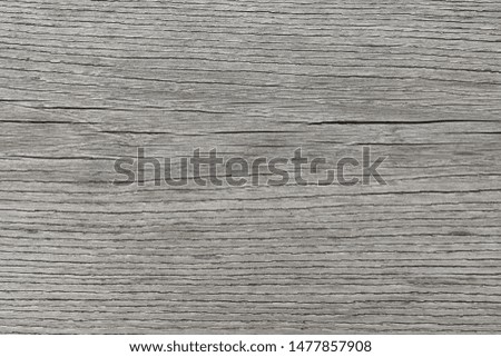 Background gray wooden old unpolished surface with horizontal fibers.