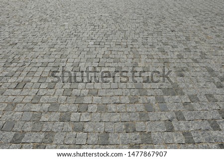 background of textured pavers on the ground