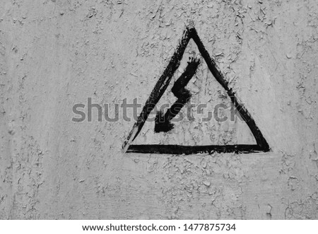 homemade electrical hazard sign on a gray background
