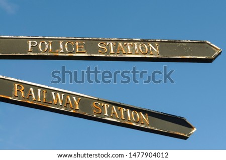 Direction signs to the police and railway stations