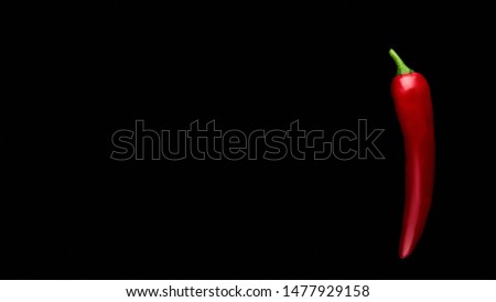 Red hot chili peppers. Food collage, black background.