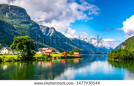 Amazing nature view with fjord and mountains. Beautiful reflection. Location: Scandinavian Mountains, Norway. Artistic picture. Beauty world. The feeling of complete freedom Royalty-Free Stock Photo #1477930544