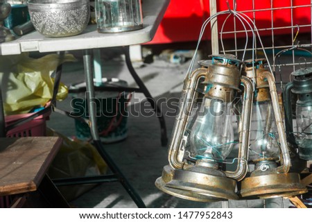 Vintage Hurricane lamps have been hanging for sale at Chatuchak weekend market in Bangkok Thailand