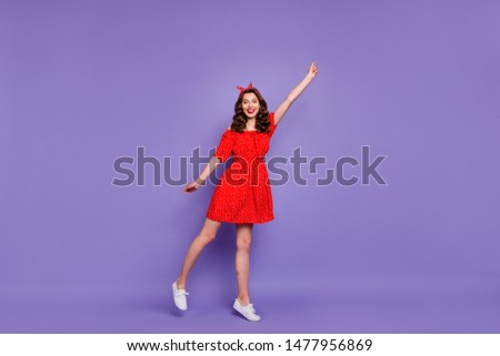Full length photo of pretty lady going to fly air wear off-shoulders dress isolated purple background