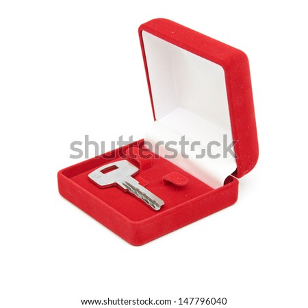 key in red gift box isolated on white