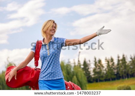 Golf concept, copy space. Women golf time holding golf equipment on green field background. The pursuit of excellence, craftsmanship, royal sport, sports banner.