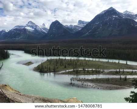 Beautiful turquoise river in the snowy mountains of Jasper National Park, Alberta Canada