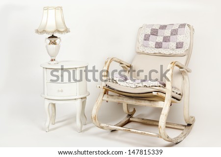 rocking chair with side table and lamp