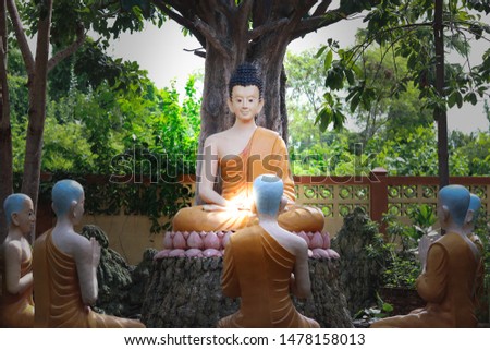 Buddha statue Is showing the way for His disciples to listen Under the Bodhi tree Located within the Thai temple Used as an illustration