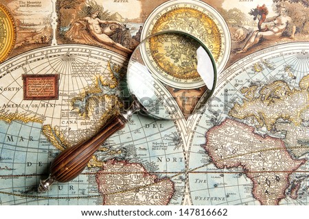 Magnifying glass and ancient old map  Royalty-Free Stock Photo #147816662