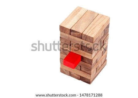 Stacked wooden block and red block on white background. Symbol of leadership, teamwork and different. Business and design concept.