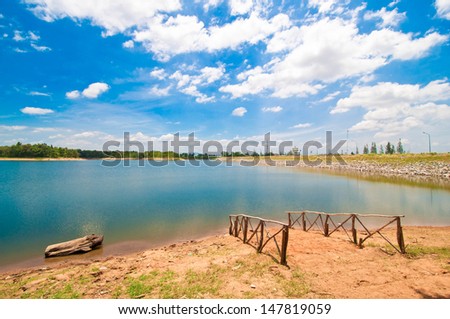 Peaceful summer rural landscape with a water reservoir