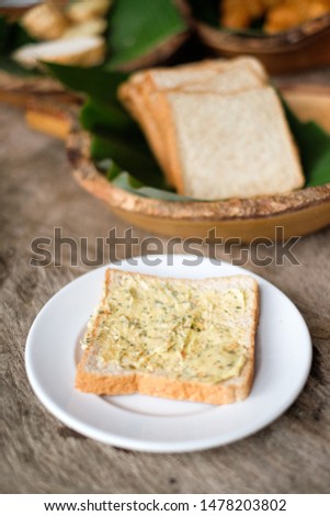 butter bread breakfast on white dish 