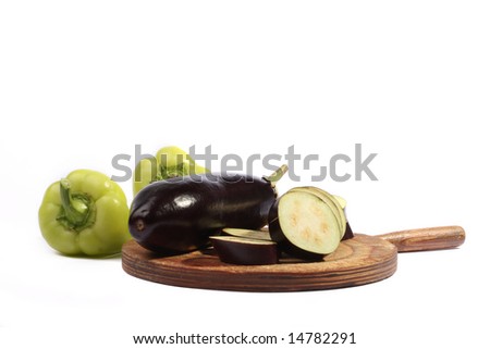 Green pepper and eggplant on a board
