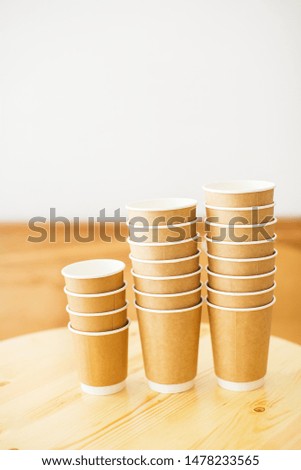 Group of paper coffee cups, space to put logo, life cafe background. Lifestyle concept.