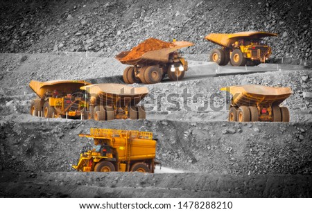 Six trucks in a busy modern gold mine in Kalgoorlie, Western Australia. Spot color. One water truck and five large haul truck transport gold ore from the Super Pit, Open cast mine. - All logos removed Royalty-Free Stock Photo #1478288210