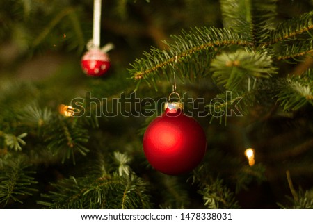 close-up of christmas decoration on a caucasian fir in warm light