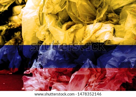 The flag Colombia is shown on the trash bag. Ecology concept with environmental pollution from household and industrial waste.
