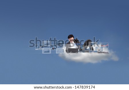 Businessman working with his laptop on a cloud