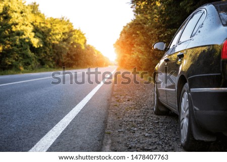 black car on asphalt road