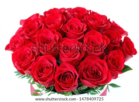 bouquet of bright scarlet roses in a round box close-up on a white background as a gift to your beloved. as a background