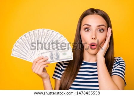 Closeup photo of pretty lady holding hands bucks fan wear striped white blue t-shirt isolated yellow background