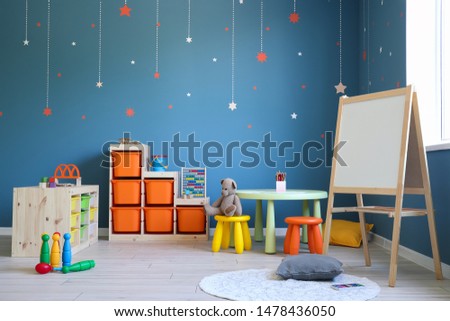 Stylish interior of modern playroom in kindergarten Royalty-Free Stock Photo #1478436050