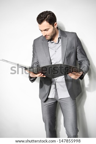 Portrait of a handsome business man ,Isolated on gray