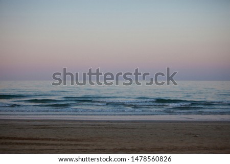Light pink sunset over the sea background