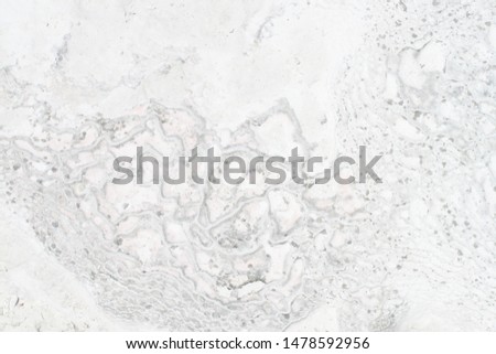 White background with a natural texture with speckles and wave.