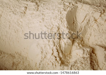 flour background. White flour texture ready for cooking. A pile of flour on a white background. bakery. Surface covered with the wheat flour as a background. vintage photo processing
