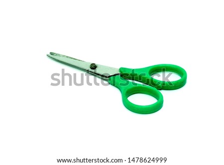 Green scissors on a white background.Use as illustration for presentation. 