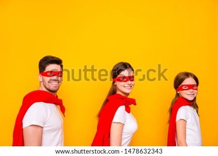 Photo of family cartoon characters carnival participants wear superhero capes isolated yellow background